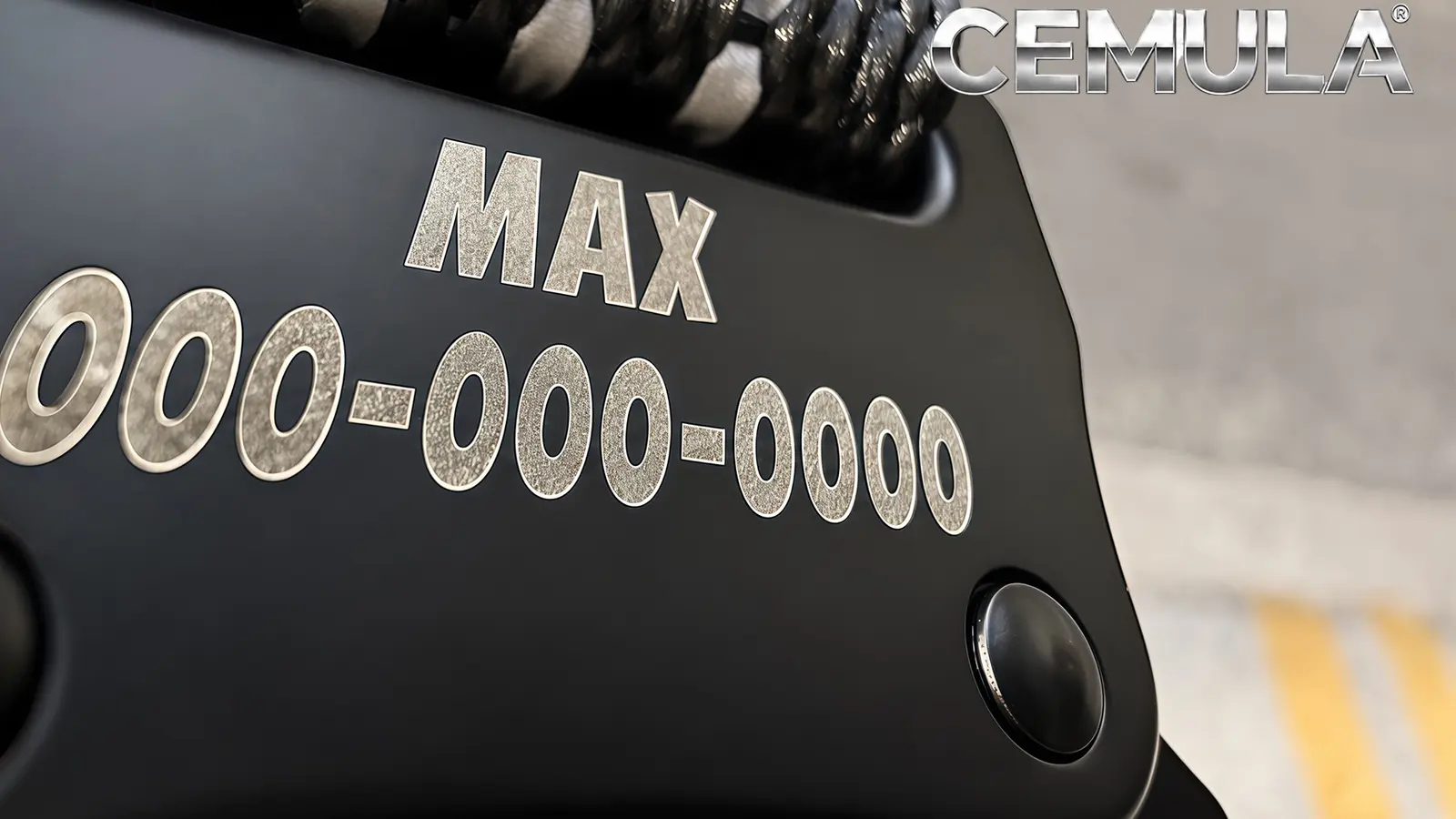 Close view of laser-engraved recovery information on a CEMULA tactical collar buckle